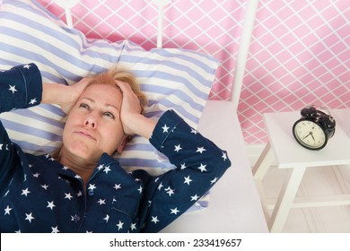 Blond woman of mature age with insomnia - Powered by Shutterstock