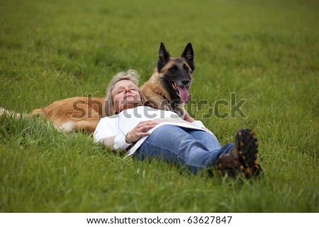 Similar – Pretty blond woman with her two dogs