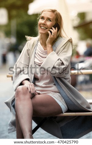 Similar – Image, Stock Photo Blonde girl wearing white sweater smiling in the street