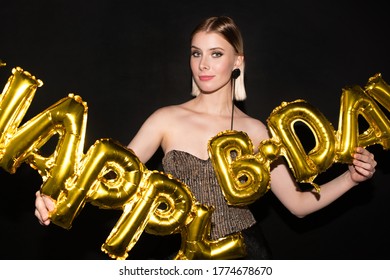 Blond Young Elegant Woman Holding Golden Color Letter Shaped Balloons While Having Birthday Party Or Congratulating Someone