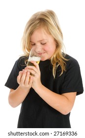 Blond Young Girl Is Drinking A Glass Of Alcohol