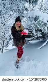 Blonde Adult Female Holding A Huge Snowball In Snow Filled Scenery, Winter Wonderland, Get Ready For Winter, Friendly Snowball Fight Ideas