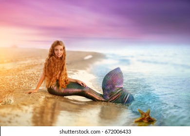 Blonde beautiful Siren Mermaid . Mermaid girl with pink tail  put feet in water. Top view. Fun, vacation concept. Text space