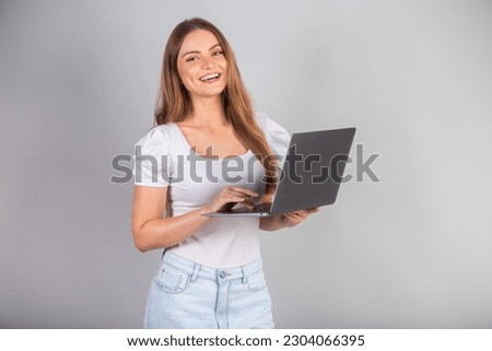 Blonde Brazilian woman with notebook
