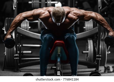 blonde brutal sexy strong bodybuilder athletic fitness man pumping up abs muscles workout bodybuilding concept background - muscular handsome men doing health care fitness exercises in gym naked torso