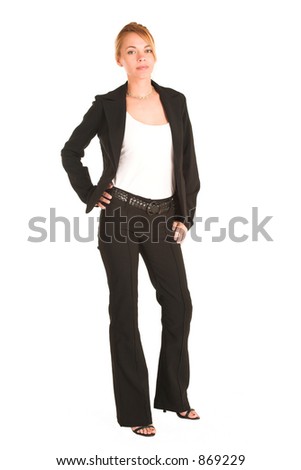 Blonde business lady in formal black suit.  Standing, with hand on her hip.  Full body