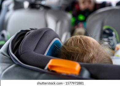 Blonde Caucasian Child Back Of Head Seen In A Rear Facing Car Seat