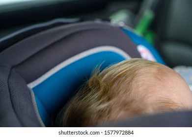 Blonde Caucasian Child Back Of Head Seen In A Rear Facing Car Seat