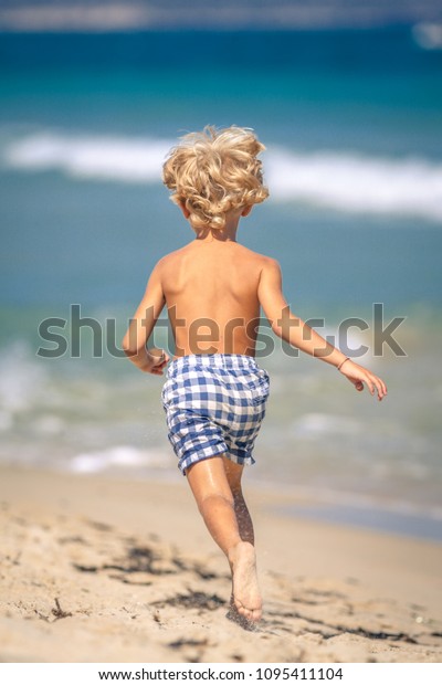 running barefoot on beach