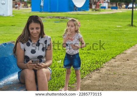 Similar – Männerhände fotografieren zwei glückliche Frauen im Freien.