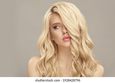 Blonde European Woman With Curly Hair, Beauty Model On Beige Isolated