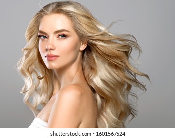 Blonde face woman curly hair beauty face natural makeup 