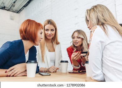 Blonde Female Employee Make Presentation For Diverse Co-workers During Meeting In Office Cafe