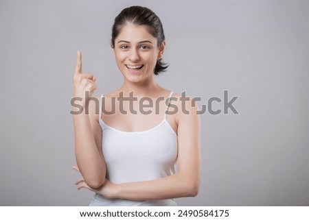 Similar – Image, Stock Photo Stylish woman with raised arm leaning on wall on street