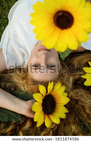 Similar – woman among daisies