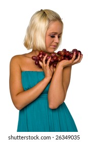 blonde girl in blue with grapes