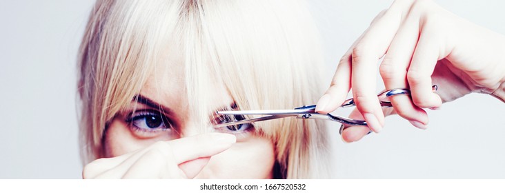 Blonde Girl Cut Forelock. Close Up Hairstyle With Bangs. Hair Care Concept