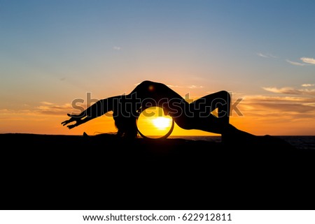 Similar – Two sisters doing gymnastics at sunset