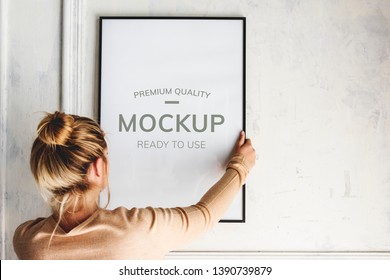 Blonde Girl Hanging A Frame Mockup