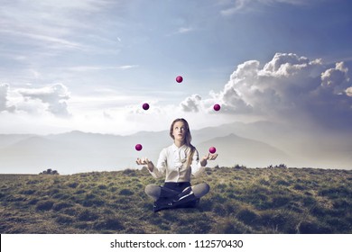 Blonde girl juggling in a wasteland