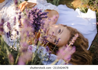 Blonde Girl In Lavender Fields In Provence In Spring Or Summer Field With Boho Style Clothing