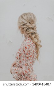 Blonde Girl With Long Pull Through Braid Wearing Floral Pink Dress
