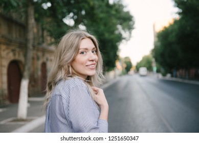 Blonde girl looking at the camera