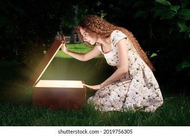 Blonde Girl Open Mystrey Box With Light Inside