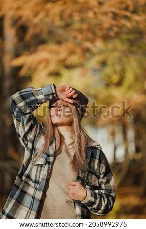 Similar – Woman with sunglasses touching over nature background