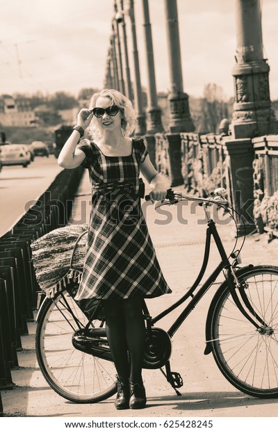 Blonde girl and retro\
bike