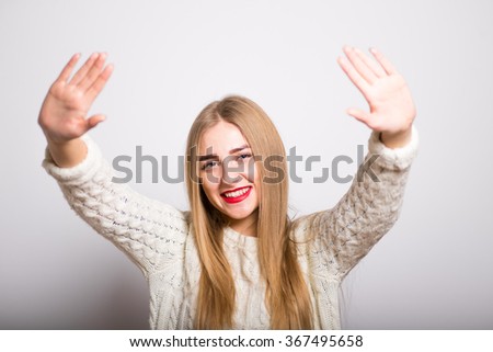 blonde girl waving arms, showing hello isolated