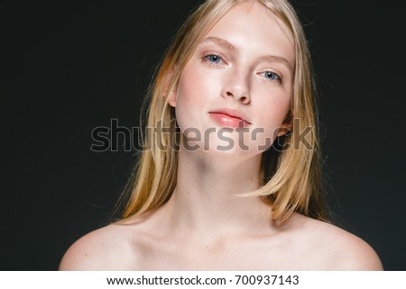Blonde girl Woman beautiful young face cosmetic closeup beauty portrait, for salon and advertisement beautiful people and healthy care skin and hair over black background