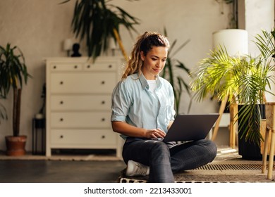 Blonde girl working online, over the laptop, at the workplace. - Shutterstock ID 2213433001