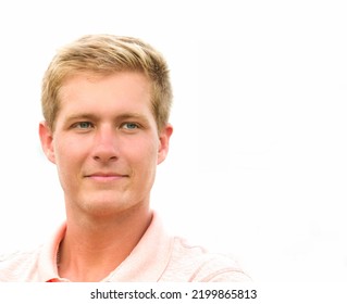 Blonde Hair Blue Eyes Man With Slight Smile White Background Copy Space Light Coral Polo Shirt