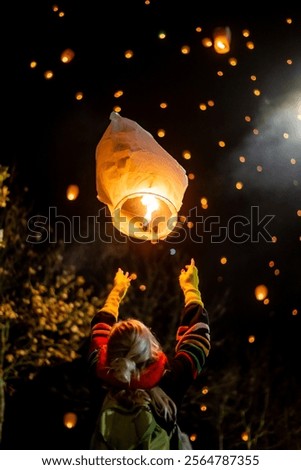 Similar – Image, Stock Photo Illuminated red sky lantern floating in dark night sky