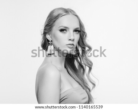 Blonde long hair woman beauty portrait with beautiful hairstyle isolated on white monochrome