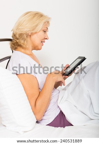 Female doctor showing results of a medical test on the tablet