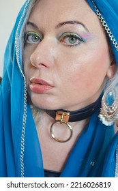 Blonde Model Girl In Turquaise Saree Head Scarf Embroderied Crazy Clothing Strange Artistic Fashion Shoot Face Close Up Collar Bright Make Up Ethno Multiculti 