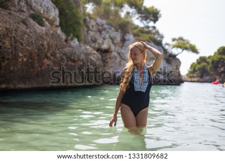 Blonde model in sea 