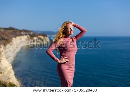 Blonde model at the sea at summer 