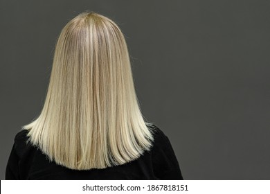 Blonde Model With Straight Hair, Look From Behind. Hair Lightening Result. Copy Space