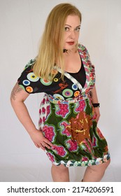 Blonde Model Wearing Colored Dress And Spiked Collar Necklace Art Fashion Bright Vintage Clothes Hippy Alternative Look Necklace Alternative Curvy Girl Tattoo Piercing Fashion Shoot