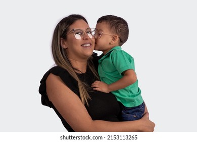 blonde mother with son in her arms wearing glasses in studio photo with white background for clipping
