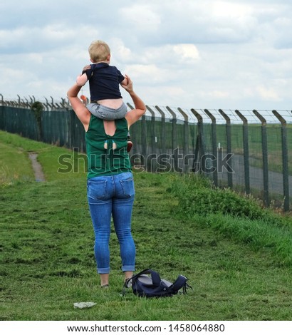 Blonde mother and son outdoors