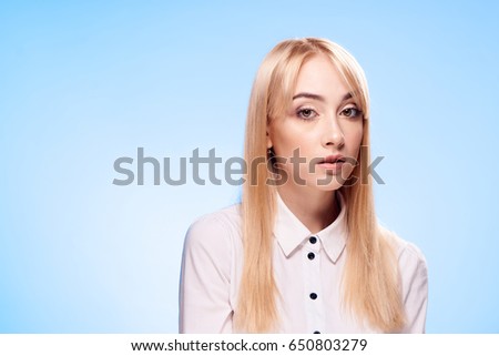Blonde on a blue background                               