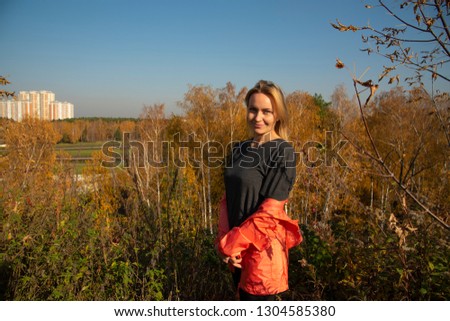 Blonde outside the city in nature