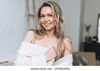 Blonde Smiling Woman 35 Year Clean Fresh Face And Hands With Long Hair In Cozy Knitted Cardigan At The Bright Interior