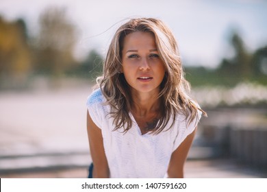 Blonde Street Hooligan Girl Looking Forward While Being On City Street