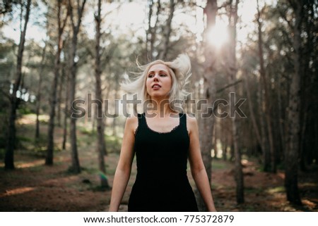 Similar – Image, Stock Photo Blonde woman portrait with the hands in her hat, discovering the forest.