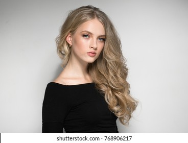 Blonde Woman Beautiful Portrait. Cosmetic Concept, Platinum Blond Curly Hair Model Girl. Studio Shot.